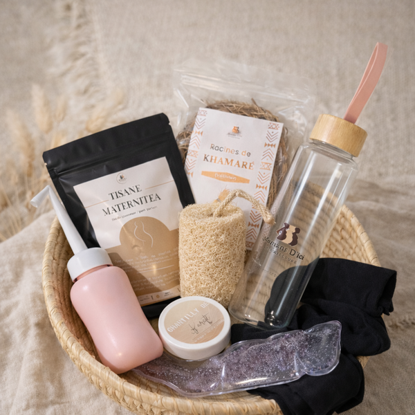 Coffret maternité DÏNGUEYA complet avec tisane, gourde en verre, douchette intime et soins post-partum.